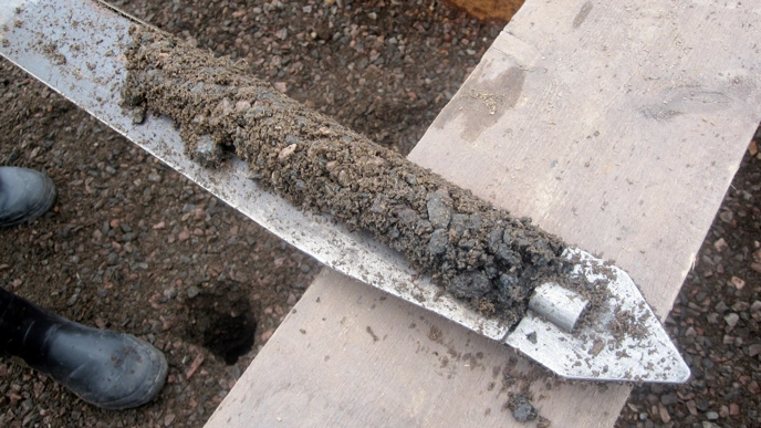 Soil on a piece of metal. Photo.