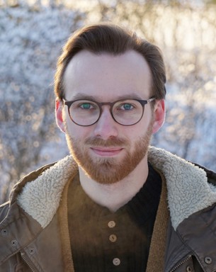 Porträttfoto av Isac Carlsson